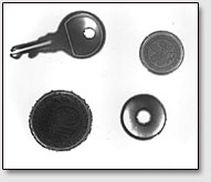 Фото. 8. Кирлиан-снимки монеты, ключа, шайбы сделанный при непосредственном контакте электрода с фотобумагой.